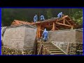 Building a wooden house & fence at the foot of the mountain is amazing