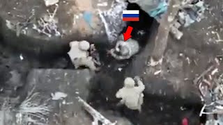 Ukrainian quadcopter drone drops grenades on a group of Russian troops oversleeping in trenches