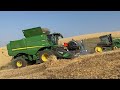 combine on hillside closeup. harvest agriculture farming johndeere