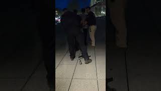 Police walk Jeff MacDonald out of Hotel UMass in Amherst