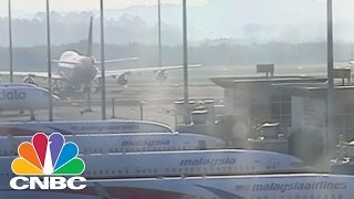 Malaysia Airlines Bans, Then Un-Bans, Checked Bags: The Bottom Line | CNBC