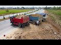 wonderful activity. use dump trucks 5t and mitsubish dozer filling flooded land next to the road.