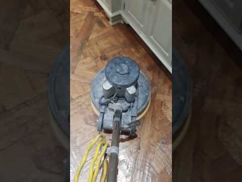 Polishing a wood floor with paste wax Polishing a wood floor with paste wax