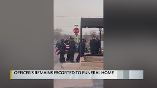 Santa Fe officer's remains escorted to funeral home