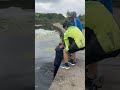 Funny moment – man struggles to get to the surface after rescuing a dog