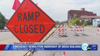 Emergency demolition underway of old brick building on Erie Boulevard