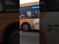 ambulance attending emergency with bus dangerously crossing intersection