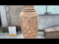 turning a large vase from solid wood skillfully working with a wood lathe