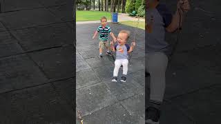 Little boy helps baby brother swing 2 哥哥帮弟弟玩荡秋千