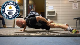 One arm push ups with a 100 lb pack - Guinness World Records