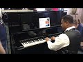 Kris Nicholson test drives a brand new Kawai K-800 Upright At Namm 2020