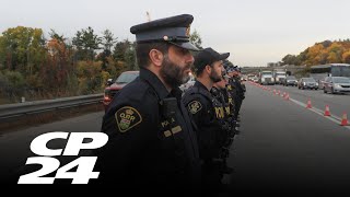 Thousands pay respects to slain Innisfil officers