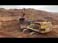 caterpillar d8h bulldozer helping the caterpillar 365c excavator