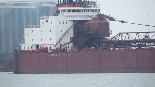 James R. Barker blows a Master Salute in honor of the Edmund Fitzgerald