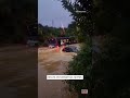 bus speeds through flooded street in new zealand shorts