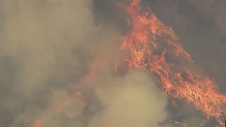 Widespread evacuations, power outages near California fire