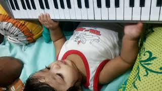 Rishaan playing keyboard