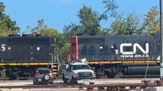 GT, ILLINOIS CENTRAL and CN GP38-2 engines creeping through Burlington, Wisconsin