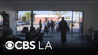 3 people injured after car crashes into Canoga Park barbershop
