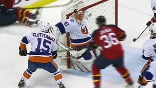 Halak pins puck on crossbar to rob Barkov