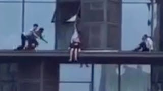 Heroic policemen rescued distressed woman from a window ledge