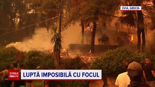 Incendiile din Grecia. Oamenii își duc mașinile pe terenurile de fotbal pentru a le salva