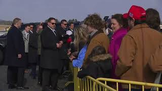 Trump signs MAGA hats in Asheville before surveying Helene flooding damage in North Carolina