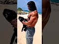 body builder on beach