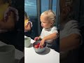 Cute Baby David eating strawberries with beautiful view