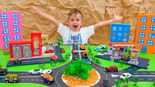 व्लाद और निकी खिलौना कारों के साथ खेलते हैं और माचिस सिटी का निर्माण करते हैं