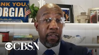Raphael Warnock delivers remarks as votes continue to be counted in Georgia