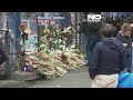 belgrade residents light candles and lay flowers in honour of school shooting victims