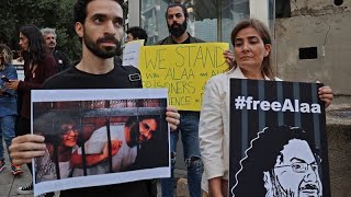 Family and supporters of jailed Egyptian activist call for his release during COP27