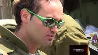 Israeli soldiers tackle a tank repair outside Jerusalem in 2002. Real World Television.