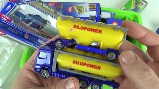 Unboxing small siku car models from box