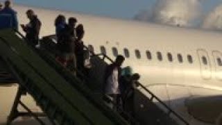 Asylum-seekers arrive in Italy after evacuation from Libya