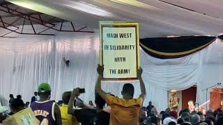 Breaking News : One Youth lifts a poster written Mash West in solidarity with the army.