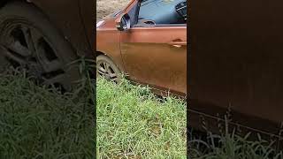 Car Stuck Unstuck from muddy soil