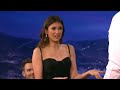 nina dobrev uses conan as her human yoga wall conan on tbs