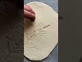 How to create ceramic art with real evergreen and pine cone imprints in clay #Handmade #pottery #art