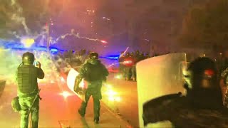 Lebanon's protesters use fireworks during clashes outside parliament | AFP