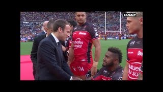 Fijians players kneel to shake French President Macron
