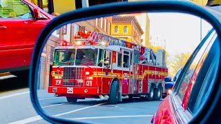 FDNY LADDER 25 RESPONDING FROM QUARTERS ON WEST 77TH STREET ON WESTSIDE OF MANHATTAN, NEW YORK CITY.