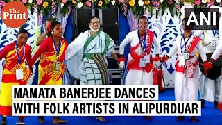 West Bengal CM Mamata Banerjee dances with folk artists at a mass wedding ceremony in Alipurduar