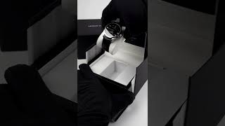 An unboxing of the Black Moonphase Watch, By Arthur Charles Watches.