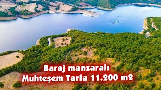 369- BARAJ MANZARALI ORMAN İÇERİSİNDE KÖYE YAKIN TARLA. 11.200 m2