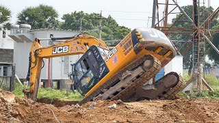 JCB 215 Excavator Digs Out Mobile Tower Foundation and Breaks Separates Concrete Bar gives level it