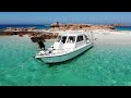 boat trip in oman al daymaniyat island white soft sand clear blue sea al muhajer marina