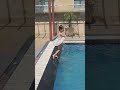 Baby swimming and diving in the pool