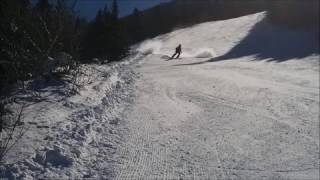 Boy Skiing Sprays Camera with Snow